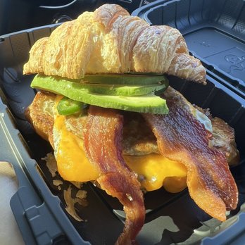 Toasted - Croissant sandwich with sausage and bacon, over easy eggs, avocado, cheese, and adding jalapeños was a very smart choice! - Coffee & Tea Near Me - Riverside, California Toasted - Croissant sandwich with sausage and bacon, over easy eggs, avocado, cheese, and adding jalapeños was a very smart choice! - Coffee & Tea Near Me - Riverside, California