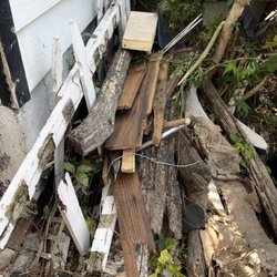 New Look Roofing - Shingles and wood thrown around