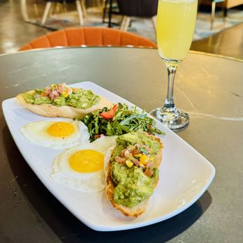 Cafe Nubia - Avocado toast with eggs - Lounges Near Me - Dallas, Texas Cafe Nubia - Avocado toast with eggs - Lounges Near Me - Dallas, Texas