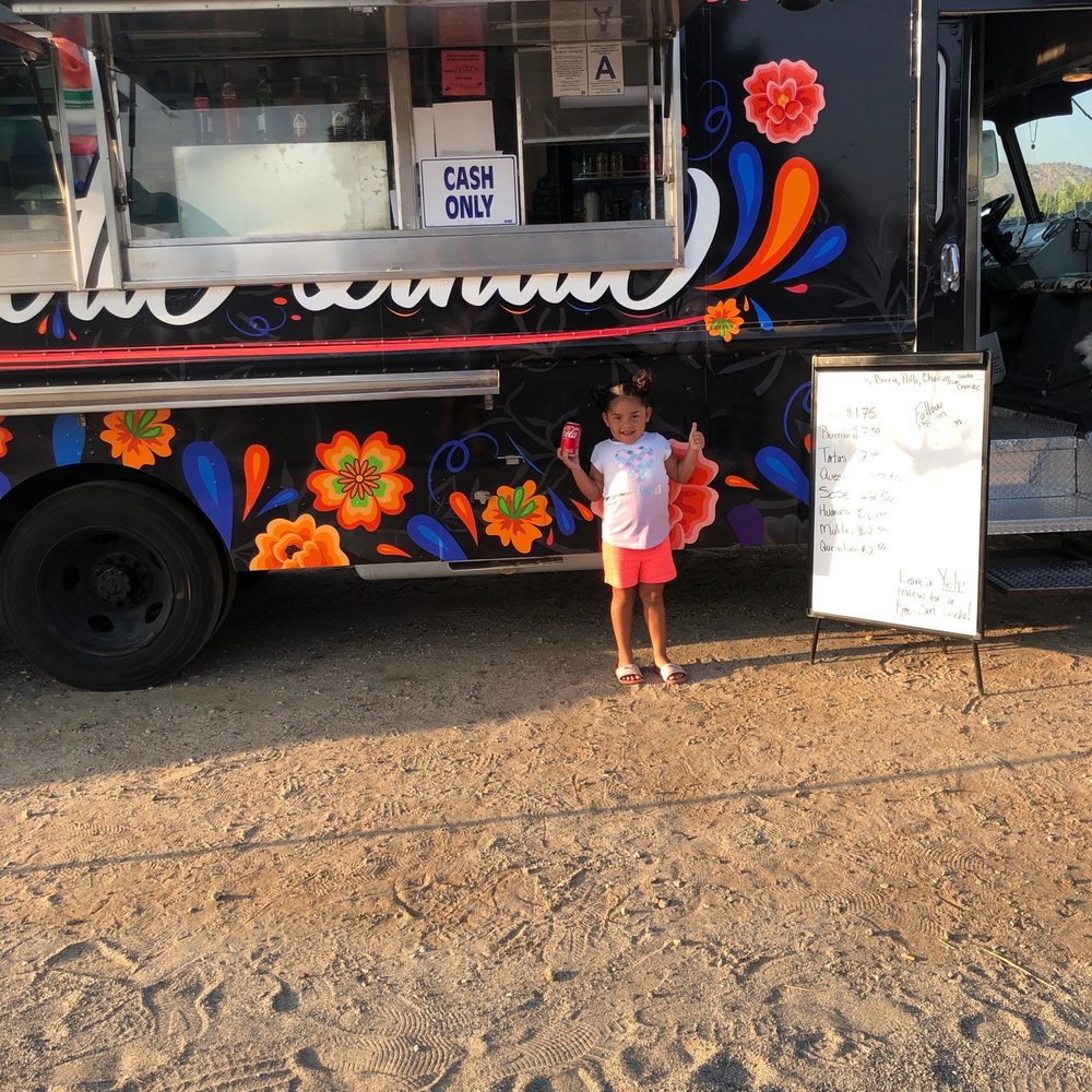 La Prieta Linda - a little girl standing in front of a food truck - Tacos Near Me - Riverside, California La Prieta Linda - a little girl standing in front of a food truck - Tacos Near Me - Riverside, California