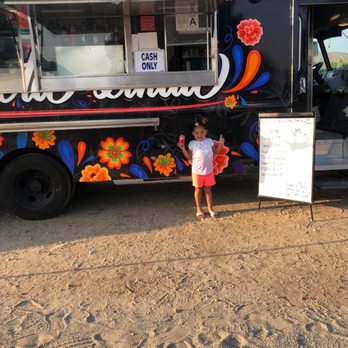 La Prieta Linda - a little girl standing in front of a food truck - Tacos Near Me - Riverside, California La Prieta Linda - a little girl standing in front of a food truck - Tacos Near Me - Riverside, California