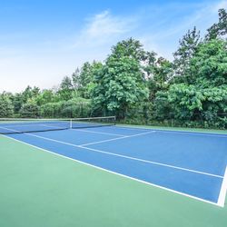 Rivertown Ridge by Red Stone Group - A tennis court available to all residents.