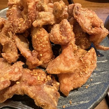 Colette - Fried pork. Nice with steamed rice. - Crispy fried pork pieces with a golden-brown coating and sprinkled with crushed peanuts, served on a dark ceramic plate. - Breakfast & Brunch Near Me - Pasadena, California