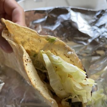 Quesadilla Lola - a hand holding a tortilla - Street Vendors Near Me - Corona, New York Quesadilla Lola - a hand holding a tortilla - Street Vendors Near Me - Corona, New York