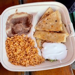 Corona’s Mexican Food - Corona's Mexican Food. Chicken Quezadilla plate with rice, refried beans, guacamole and sour cream ($10).