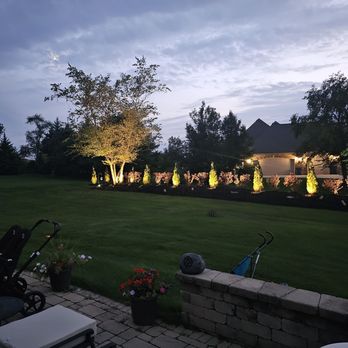 Drakes Landscaping - a backyard with lawn lighting - Snow Removal Near Me Drakes Landscaping - a backyard with lawn lighting - Snow Removal Near Me