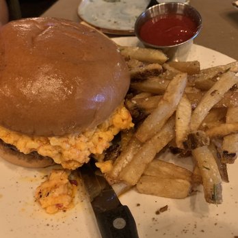 Bird and Bottle - Pimento Cheese Burger with grilled onions and bacon jam with upgraded truffle parmigiana fries. You want this in your mouth. - New American Near Me - Tulsa, Oklahoma