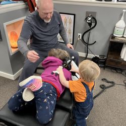 Longmont Spine and Physical Medicine - My daughter is being adjusted. My son is pretending to help. The doctors are so good with kids!
