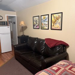 The Outback - Couch to relax and watch tv. Nice heating unit beside it.