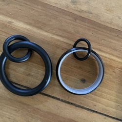 Pottery Barn - The old curtain rings and the new, easier to slide, new ones.  What a joke.