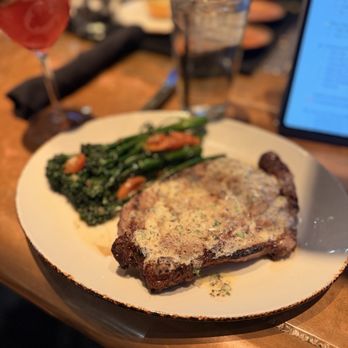 Haywire - 13 OZ BONELESS RIBEYE (meh) with CHARRED BROCCOLINI - New American Near Me - Dallas, Texas Haywire - 13 OZ BONELESS RIBEYE (meh) with CHARRED BROCCOLINI - New American Near Me - Dallas, Texas