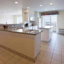 Holiday Inn Express & Suites Petoskey - Beautiful kitchen with utensils, stairway to the left to go down to bedrooms