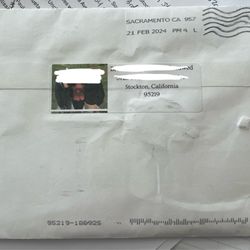 US Post Office - Back: The return label with photo and 8pt font on the upper back middle. Notice the machine ink over where the stamp would be.