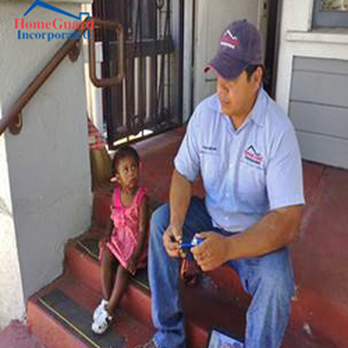 Homeguard Incorporated - a man sitting on the steps with a child - Home Inspectors Near Me - Corona, California Homeguard Incorporated - a man sitting on the steps with a child - Home Inspectors Near Me - Corona, California