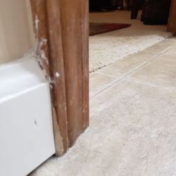 Bath Pro Evansville - Dry wall mud was not cleaned off surfaces, had been tracked onto carpet and cut out by ME....see damaged door frame