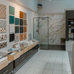 Marble Systems - Marble Systems Fairfax showroom featuring colorful tile, marble, mosaics, natural stone, and a modern shower display in Virginia.