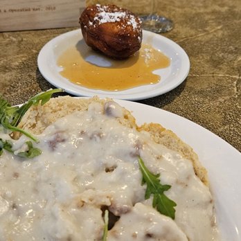 The Junction Kitchen - Biscuits and sausage gravy with a donut in maple syrup. - Breakfast & Brunch Near Me - North Charleston, South Carolina The Junction Kitchen - Biscuits and sausage gravy with a donut in maple syrup. - Breakfast & Brunch Near Me - North Charleston, South Carolina