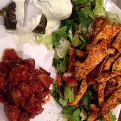 Falafel King - Grilled chicken plate with stuffed grape leaves and roasted eggplant