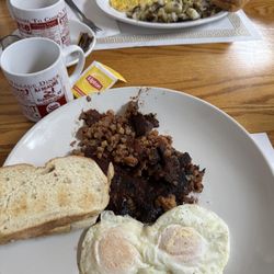 Cooks Village Diner - Corn beef hash two eggs over easy Italian toast. Ham and onion omelette, home fries, sourdough toast, a little well done.