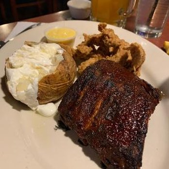 O'Charley's Restaurant & Bar - My husband's plate with delicious ribs, a nice baked potato, but not-my-kind-of-thing fried chicken tenders! - American Near Me - Hiram, Georgia O'Charley's Restaurant & Bar - My husband's plate with delicious ribs, a nice baked potato, but not-my-kind-of-thing fried chicken tenders! - American Near Me - Hiram, Georgia
