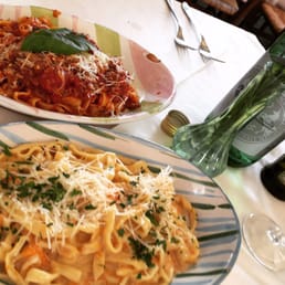 Spaghetti with bolognaise and homemade pasta with pumpkin cream sauce with shrimp.