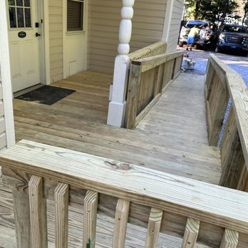 Sure Shot Outdoor Services - a wooden porch with railings - Fences & Gates Near Me Sure Shot Outdoor Services - a wooden porch with railings - Fences & Gates Near Me