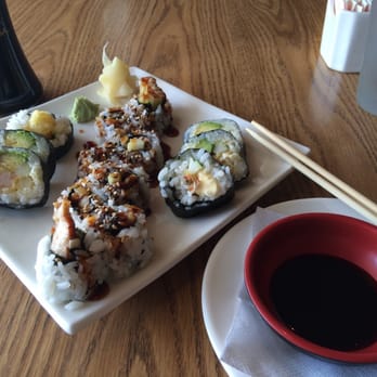 Thai Nivas Cafe - Eel and cucumber roll (middle) and shrimp tempura roll (edges) - Thai Near Me - Saint Louis, Missouri Thai Nivas Cafe - Eel and cucumber roll (middle) and shrimp tempura roll (edges) - Thai Near Me - Saint Louis, Missouri