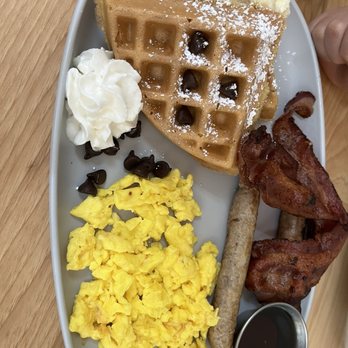 The Breeze Cafe - Kids waffle with chocolate chips bacon and sausage. Chocolate chips, bacon and sausage were extra charges - Breakfast & Brunch Near Me - Newark, California The Breeze Cafe - Kids waffle with chocolate chips bacon and sausage. Chocolate chips, bacon and sausage were extra charges - Breakfast & Brunch Near Me - Newark, California