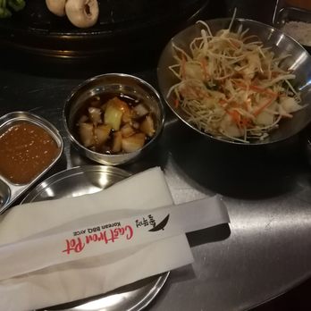 The Cast Iron Pot 3 - Sauces and Condiments with shared salad and kimchi. - Korean Near Me - Flushing, New York The Cast Iron Pot 3 - Sauces and Condiments with shared salad and kimchi. - Korean Near Me - Flushing, New York