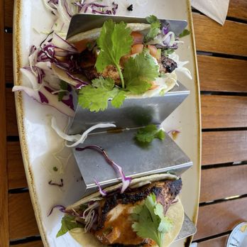 Monkeypod Kitchen by Merriman - Fish tacos with one already consumed. Absolutely delicious - New American Near Me - Kihei, Hawaii