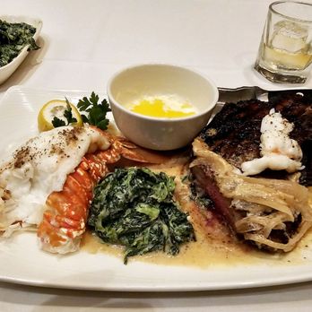 The Capital Grille - Kona-Crusted Dry Aged Bone-In NY Strip with Shallot Butter, South African Lobster Tail & Creamed Spinach - Steakhouses Near Me - Austin, Texas The Capital Grille - Kona-Crusted Dry Aged Bone-In NY Strip with Shallot Butter, South African Lobster Tail & Creamed Spinach - Steakhouses Near Me - Austin, Texas