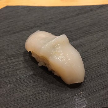 Sushi Suzuki - Sea scallop with yuzu paper underneath and Sake sauce on top - Sushi Bars Near Me - Seattle, Washington