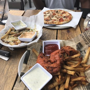 Howell's Kitchen and Bar - Buffalo Chicken Tenders // Pub Fries // Meat Pizza - Pizza Near Me - Atlanta, Georgia Howell's Kitchen and Bar - Buffalo Chicken Tenders // Pub Fries // Meat Pizza - Pizza Near Me - Atlanta, Georgia