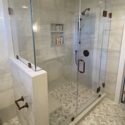 Lighthouse Shower Doors - Corner Enclosure with Return on knew wall; Antique Bronze Hardware; low iron glass with protective coating