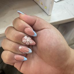 This is the nails 1st day the picky is crooked. The petals of the flower are inconsistent.