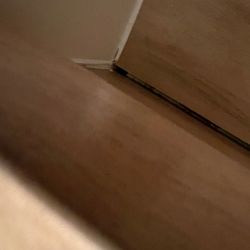 Precise Tile Marble And Wood Floors - Gap in floor tread and riser.