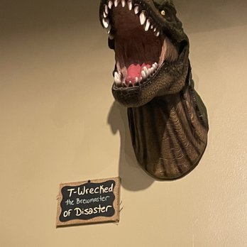 Po'Boy Brewery - a dinosaur head and a sign - Breweries Near Me - Port Jefferson Station, New York Po'Boy Brewery - a dinosaur head and a sign - Breweries Near Me - Port Jefferson Station, New York