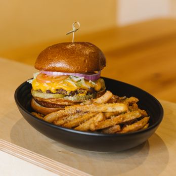 Whiskey's On Main - Whiskey's signature burger with a side of truffle fries - Sports Bars Near Me - Ketchum, Idaho