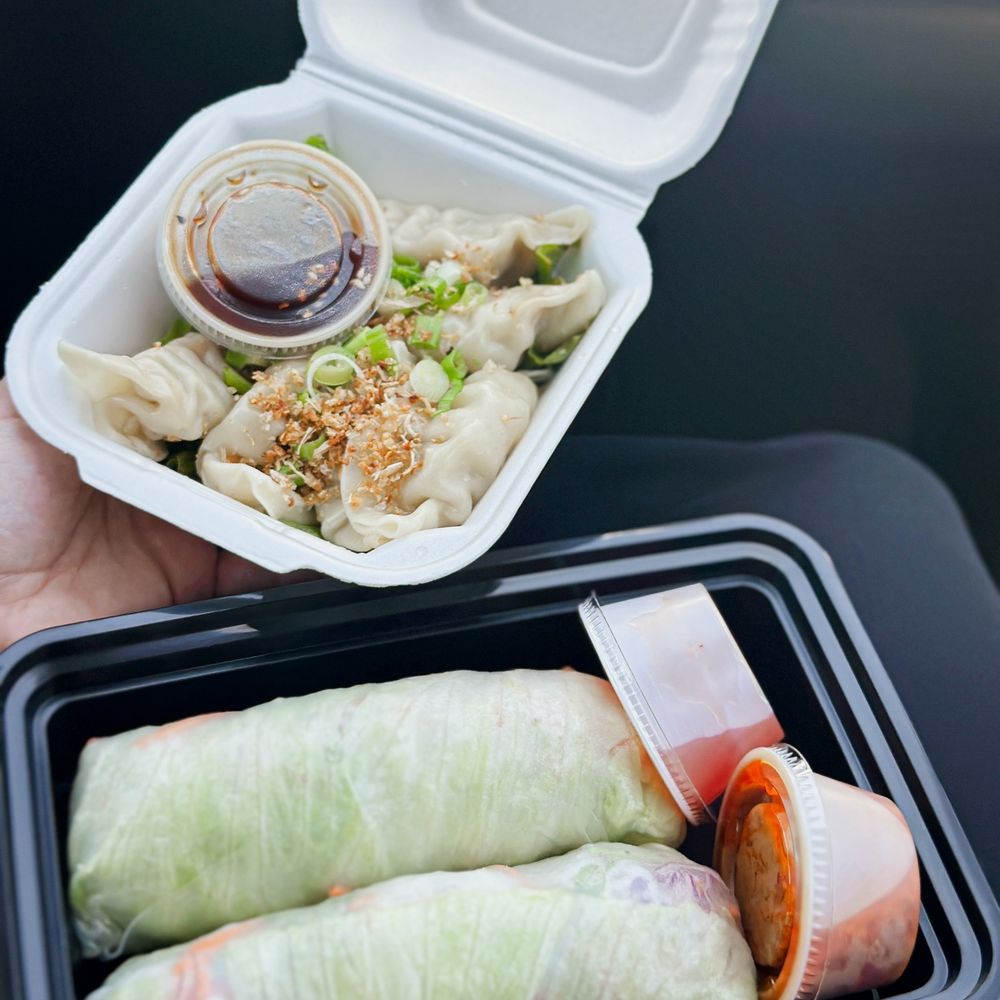 Thawan Thai Cuisine - a person holding a container of food - Thai Near Me - Norman, Oklahoma Thawan Thai Cuisine - a person holding a container of food - Thai Near Me - Norman, Oklahoma
