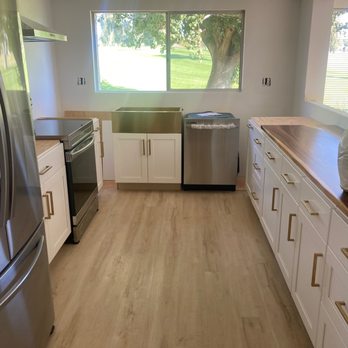 AVA Flood Restoration - New Remodel - Almost done kitchen - cabinets, painting, and slab - General Contractors Near Me