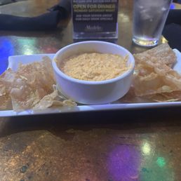 Buffalo chicken dip with wonton chips.