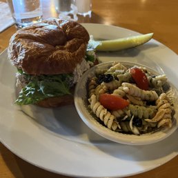 Signature chicken salad croissant with side of Italian pasta salad.