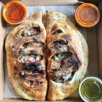 Troni Brothers Pizza - Left - Meat Lover Calzone Right - Deluxe Calzone - Pizza Near Me - Kettering, Ohio Troni Brothers Pizza - Left - Meat Lover Calzone Right - Deluxe Calzone - Pizza Near Me - Kettering, Ohio