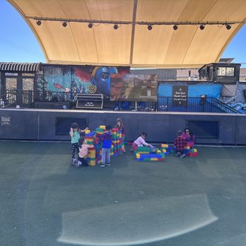 Downtown Container Park - Giant lego play area on artificial grass for the kiddos - Shopping Centers Near Me - Las Vegas, Nevada