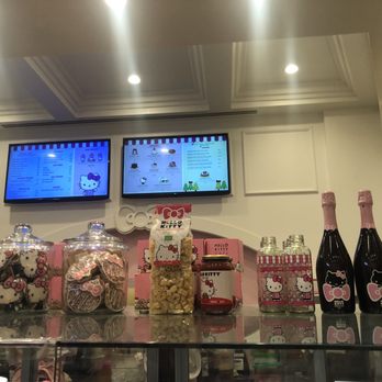 Hello Kitty Cafe - Quick shot of menu and the Glass case at cafe with treats that are available for purchase. - Cafes Near Me - Irvine, California