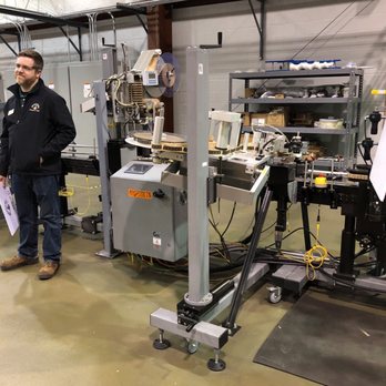 Michter's Distillery - a man standing in a factory - Distilleries Near Me