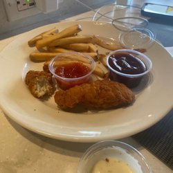 Loft - What's left of my chicken strips. Not too bad. They were hot. Came with BBQ sauce and ketchup.