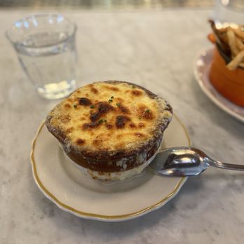 Parc de Ville - French onion soup. Little in the way of garnish in comparison to other photos. This was ordered under the new head chef. - French Near Me - Fairfax, Virginia