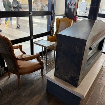 Caffè Nero - Seating by the fireplace - Coffee & Tea Near Me - Peabody, Massachusetts