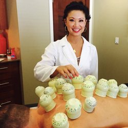 Eastern Medical Center - Dr. Teresa Shen, acupuncturist.  Performing cupping on a patient.